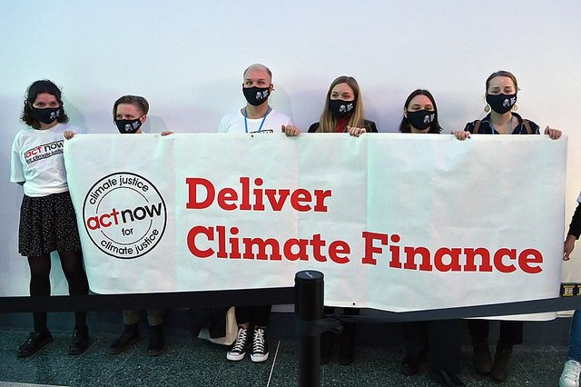 COP26 activists demand climate justice  photo by  Dean Calma/IAEA